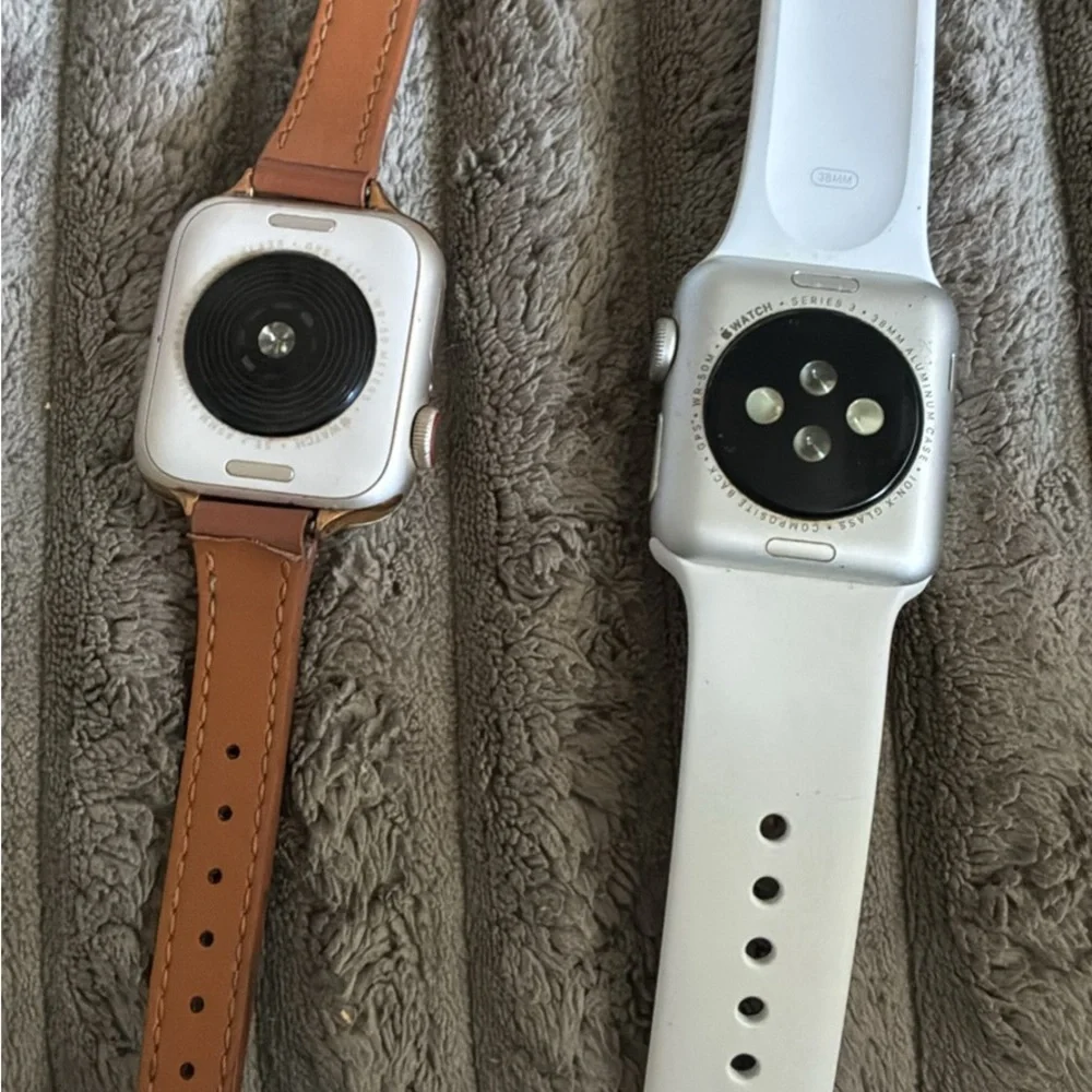 Apple Smartwatches with Brown Leather and White Sport Bands